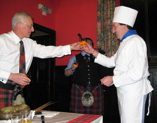 Piper and chef enjoy a dram