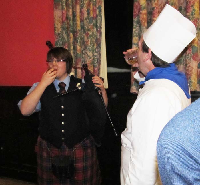 Piper and chef enjoy a dram